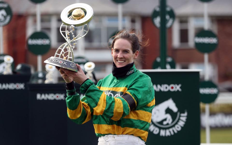 Blackmore lifts the Randox Grand National Handicap Chase trophy - PA