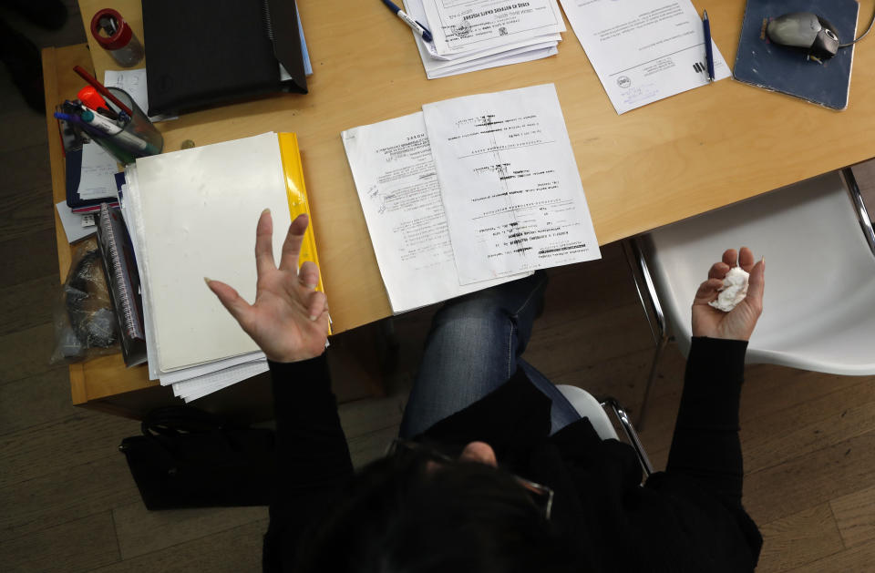 In this photo taken Tuesday, Nov. 26, 2019, Mirjana Novokmet gestures during an interview with the The Associated Press in Belgrade, Serbia. After years of waiting, Serbian lawmakers are set to soon pass a bill that authorities say attempts to shed light on a chilling, decades-old scandal involving hundreds of families who suspect their babies were stolen at birth. Mirjana Novokmet does not believe that this special law will help uncover what happened to her first child back in 1978. (AP Photo/Darko Vojinovic)