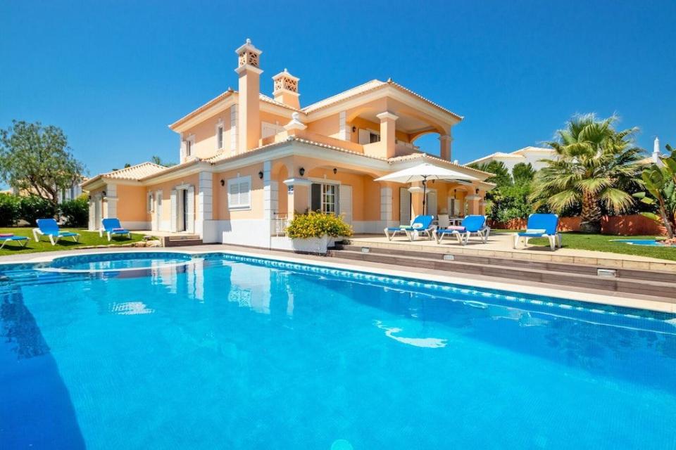 <p>Soak up the summer sun at this sprawling villa in Portugal's southernmost region. Blessed with glorious sandy beaches and picturesque fishing towns, this golden villa is the perfect retreat after exploring the local town.</p><p>The team at Vrbo say: 'With a large private swimming pool, beautiful garden and impressive traditional Algarvian barbecue, this fantastic villa is ideal for couples or families looking to holiday in one of the most sought-after areas of the Algarve.'</p><p>This villa is available to book via <a href="https://www.vrbo.com/10408095ha" rel="nofollow noopener" target="_blank" data-ylk="slk:Vrbo;elm:context_link;itc:0;sec:content-canvas" class="link ">Vrbo</a> for £463 per night. </p><p><a class="link " href="https://www.vrbo.com/10408095ha" rel="nofollow noopener" target="_blank" data-ylk="slk:BOOK NOW;elm:context_link;itc:0;sec:content-canvas">BOOK NOW</a><br></p>