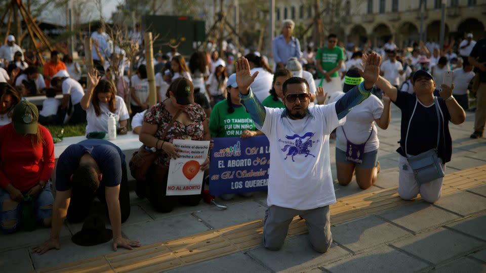 Religious activists pray after an April 2018 demonstration in El Salvador’s capital against a proposal to decriminalize abortion. Some in the socially conservative country, which is largely Catholic and evangelical Christian, viewed the accounts of Vásquez and other women with skepticism and hostility. - Jose Cabezas/Reuters