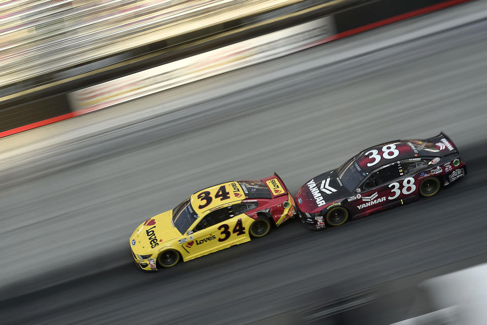 BRISTOL, TENNESSEE - JULY 15: Michael McDowell, driver of the #34 Love's Travel Stops Ford, races John H. Nemechek, driver of the #38 YANMAR Ford, during the NASCAR Cup Series All-Open at Bristol Motor Speedway on July 15, 2020 in Bristol, Tennessee. (Photo by Jared C. Tilton/Getty Images)