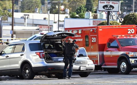 Police officers on the scene - Credit: Robyn Beck/AFP