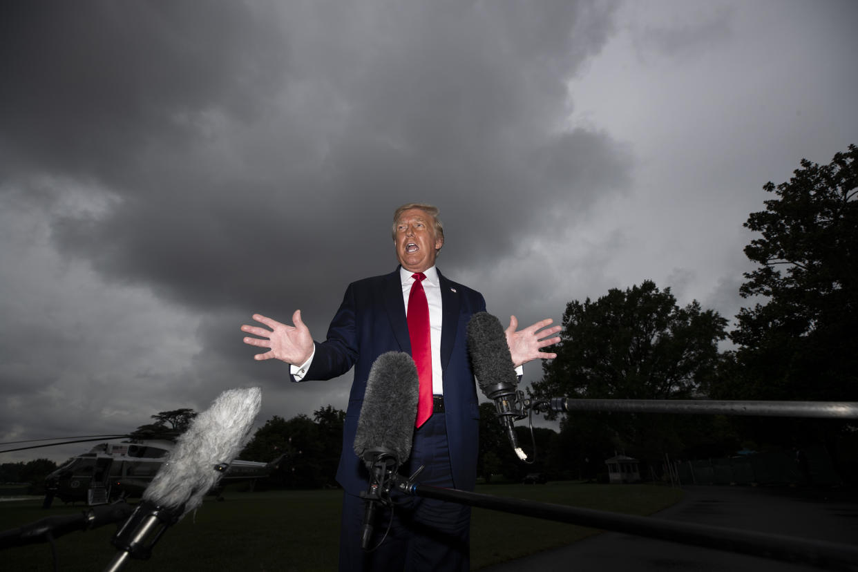 President Donald Trump speaks with reporters before walking to Marine One on the South Lawn of the White House on July 31, 2020, in Washington. (Alex Brandon/AP)