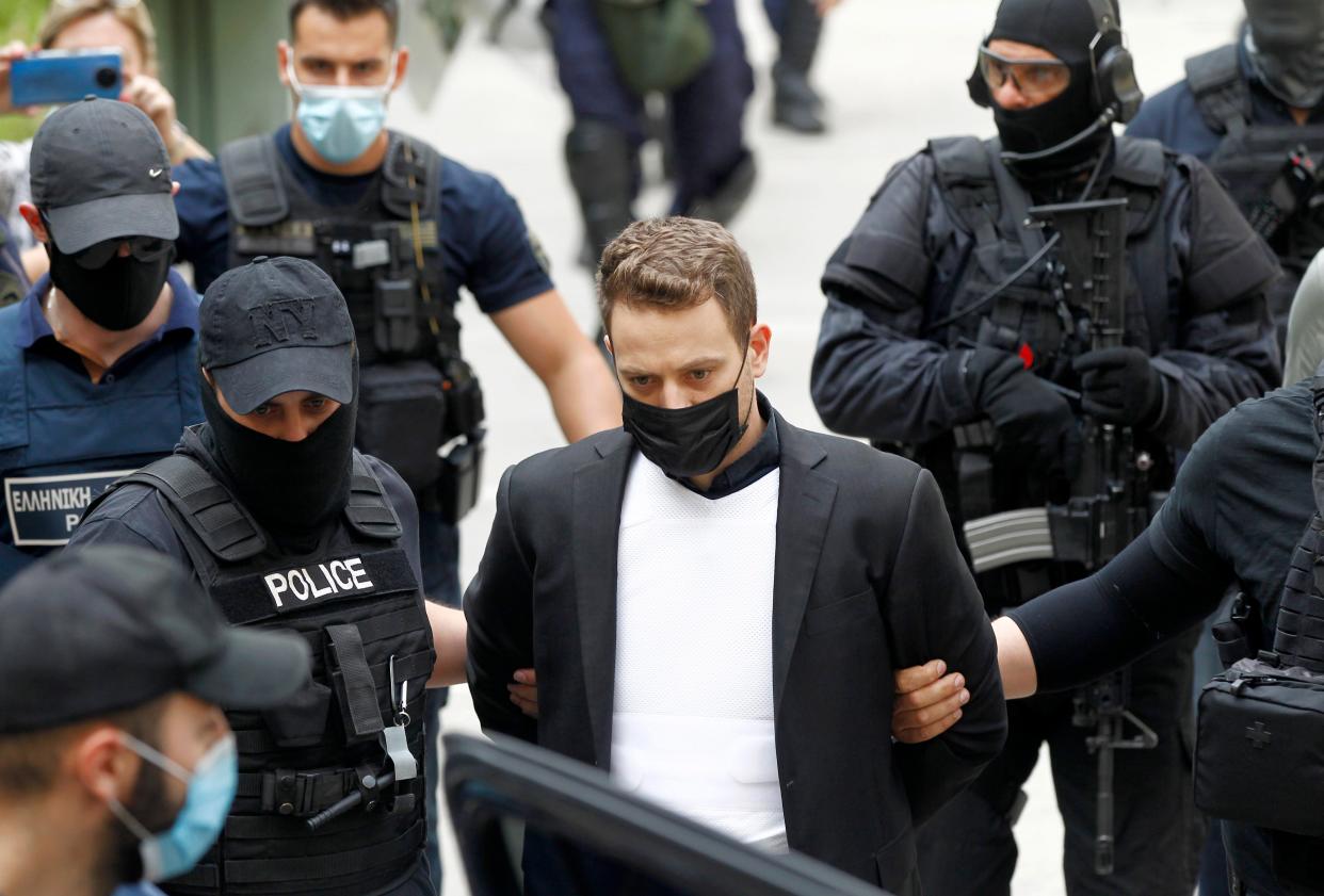 Pilot Babis Anagnostopoulos, husband of murdered Caroline Crouch, leaves the court in Athens (EPA)