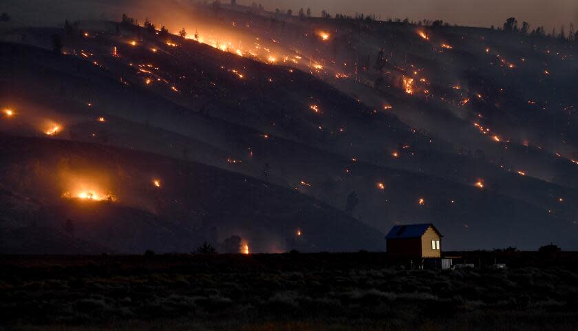 A house sits alone as the Lake Fire creeps its way up the hill towards Palmdale Friday. (Wally Skalij/Los Angeles Times)