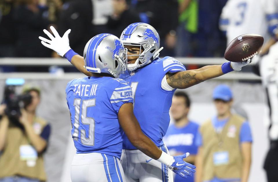 Detroit Lions wide receiver Marvin Jones, right celebrates his 39-yard reception for a touchdown with teammate wide receiver Golden Tate (15) during the first half of an NFL football game against the Seattle Seahawks, Sunday, Oct. 28, 2018, in Detroit. (AP Photo/Rey Del Rio)