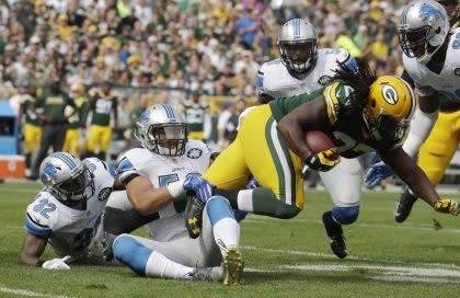 Kyle Van Noy, here tackling Green Bay's Eddie Lacy, is headed for New England. (AP)