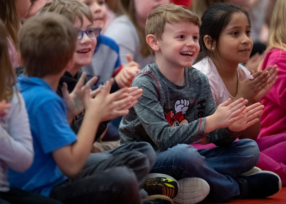 Vogel Elementary School first-graders applaud for Elementary School Teacher of the Year Kenneth “Kennan” Barnett in Evansville, Ind., Wednesday morning, April 6, 2022. The University of Evansville’s annual Outstanding Educators of the Year awards are also sponsored by the Evansville Teachers Federal Credit Union and the Courier & Press.