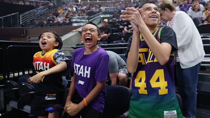 Utah Jazz fans Adam Carrillo, Xavier Leon and Evan Carrillo applaud during a draft fan event in Salt Lake City on Thursday, June 22, 2023, during the NBA draft.