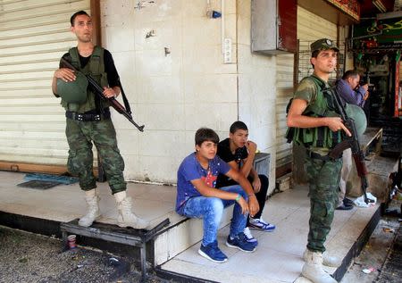 Members of Palestinian security forces take position following clashes with Palestinian youths in the old town of the West Bank city of Nablus August 23, 2016. REUTERS/Abed Omar Qusini