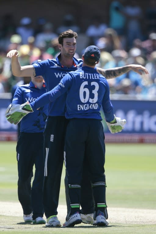 England's bowler Reece Topley (C) celebrates the dismissal of South African batsman JP Duminy (not in picture) during the second One Day International match between England and South Africa at St. George's park on February 6, 2016 in Port Elizabeth