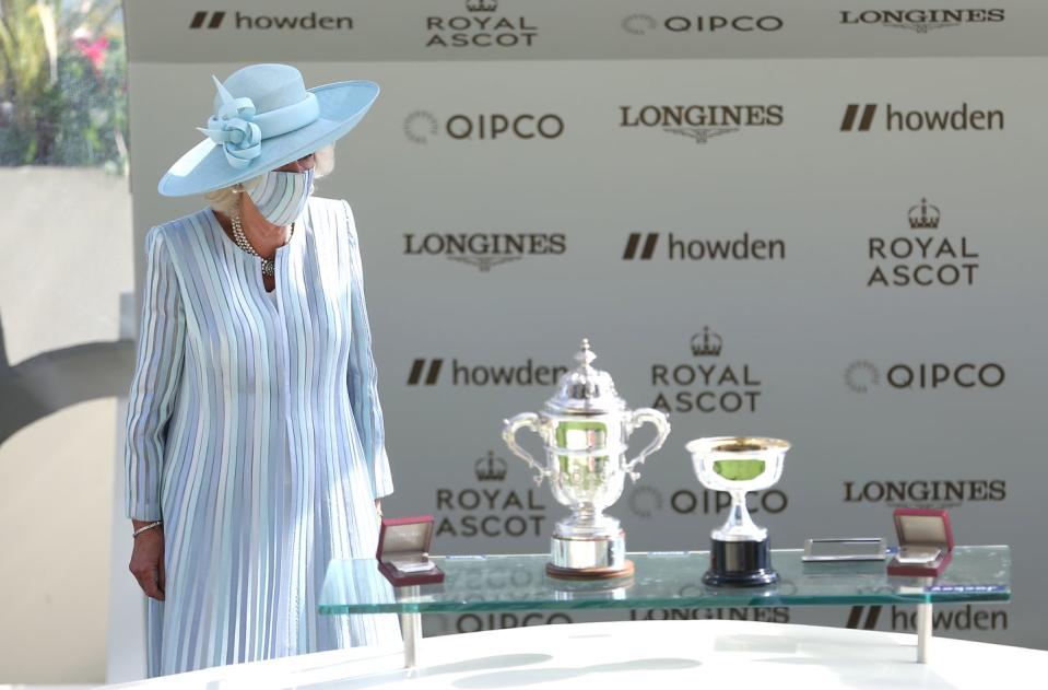 <p>Camilla, Duchess of Cornwall, just prior to presenting Manning with a trophy. </p>