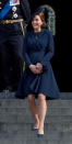 <p>The Duchess was all smiles in a navy coat by Beulah London paired with blue suede heels.<br><i>[Photo: PA]</i> </p>