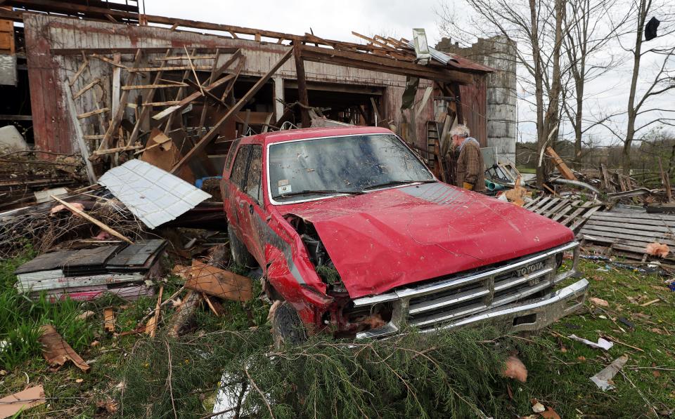 A Windham resident searches through rubble for her belongings Thursday, April 18, 2024, after an EF-1 tornado struck Wednesday, April 17, 2024, in Windham.