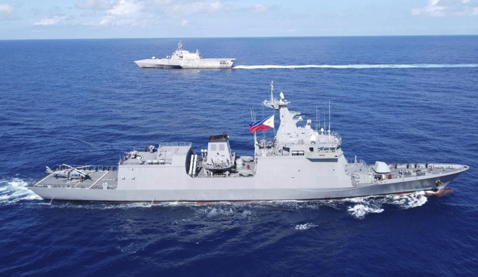 FILE - In this handout photo released by Armed Forces of the Philippines, Philippines BRP Jose Rizal (FF150), right, and USS Gabriel Giffords (LCS 10) during a tactical exercise between Philippines and the United States in the West Philippine Sea on Thursday Nov. 23, 2023. The Chinese military said on Dec. 4 that American naval ship USS Gabriel Giffords had "illegally intruded" on Monday into waters near the Second Thomas Shoal, the site of a hot territorial dispute between China and the Philippines in the South China Sea. (Armed Forces of the Philippines via AP, File)