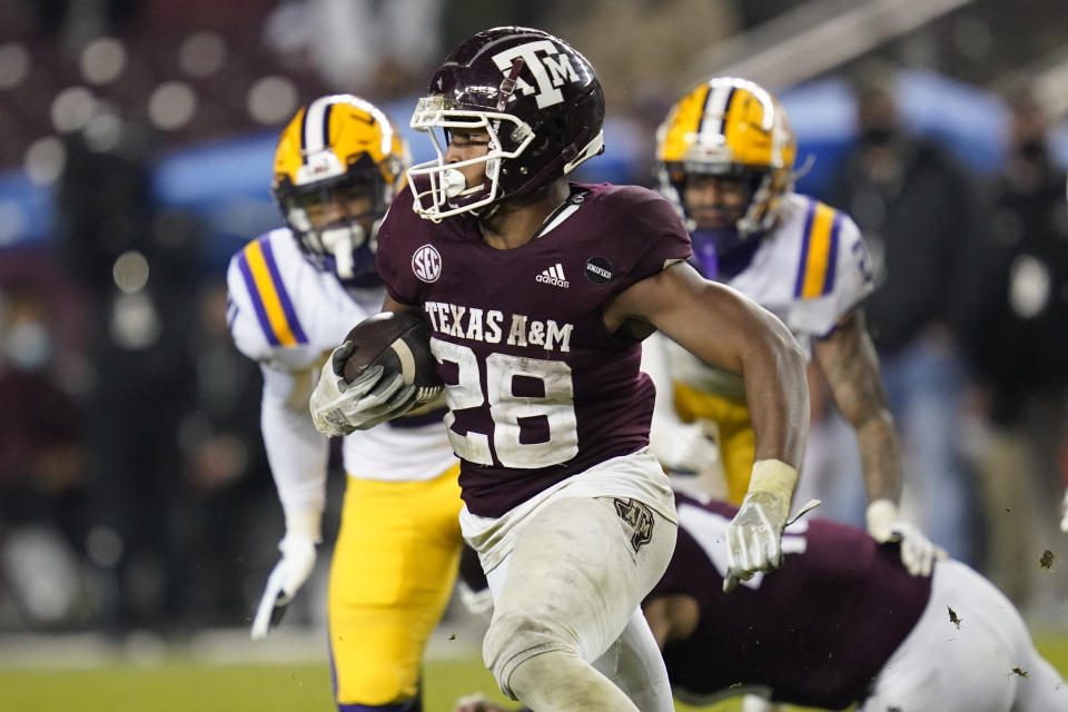 Texas A&M running back Isaiah Spiller (28) carries against LSU during the fourth quarter of an NCAA college football game Saturday, Nov. 28, 2020, in College Station, Texas. (AP Photo/Sam Craft)