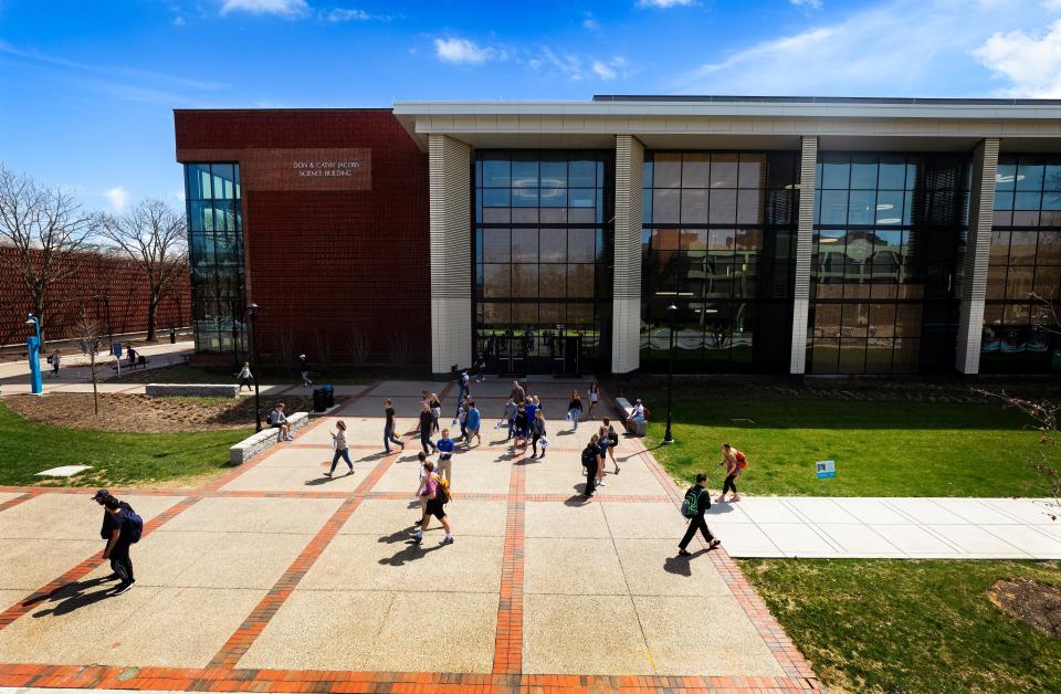 University of Kentucky students walk near the institution's Jacobs Science Building in 2019. The public institution in Lexington, Kentucky, plans to give all of its students investment accounts by fall 2023 to help promote financial literacy.