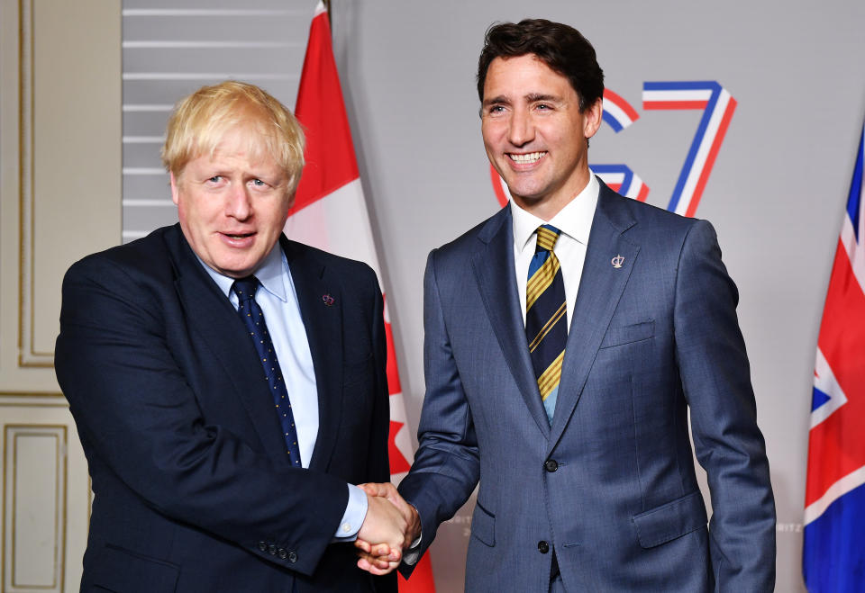 BIARRITZ, FRANCE - AUGUST 24: British Prime Minister Boris Johnson (L) shakes hands with Prime Minister of Canada Justin Trudeau ahead of a bilateral meeting on August 24, 2019 in Biarritz, France. The French southwestern seaside resort of Biarritz is hosting the 45th G7 summit from August 24 to 26. High on the agenda will be the climate emergency, the US-China trade war, Britain's departure from the EU, and emergency talks on the Amazon wildfire crisis. (Photo by Jeff J Mitchell - Pool/Getty Images)