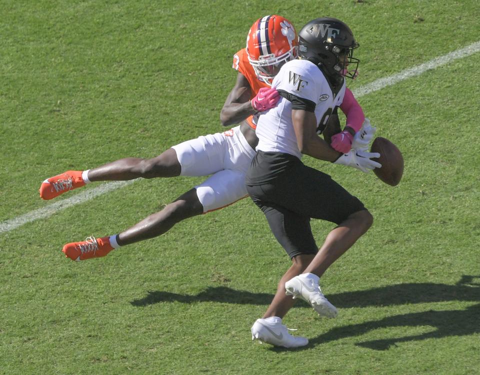 Clemson cornerback Toriano Pride Jr. (23) tackles \w8o\ during the first quarter Oct 7, 2023; Clemson, South Carolina, USA; at Memorial Stadium.