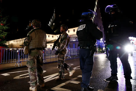 Police and soldiers secure area where a suspect is sought after a shooting in Strasbourg, France, December 11, 2018. REUTERS/Christian Hartmann