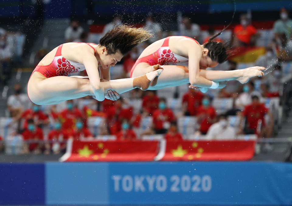 <p>TOKYO, JAPAN - JULY 25: Shi Tingmao and Han Wang of China compete in the Women's Synchronised 3m Springboard final on day two of the Tokyo 2020 Olympic Games at Tokyo Aquatics Centre on July 25, 2021 in Tokyo, Japan. (Photo by Ian MacNicol/Getty Images)</p> 