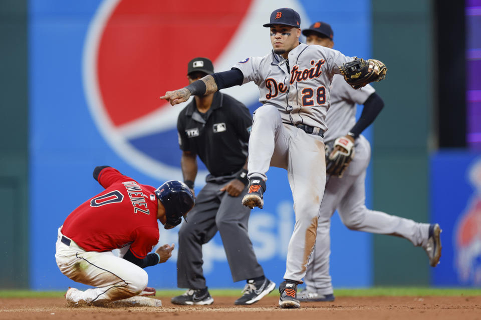 Detroit Tigers shortstop Javier Baez (28) reacts after forcing out Cleveland Guardians' Andres Gimenez at second base but not being able to throw out Myles Straw at first base during the fourth inning of a baseball game Wednesday, Aug. 17, 2022, in Cleveland. (AP Photo/Ron Schwane)
