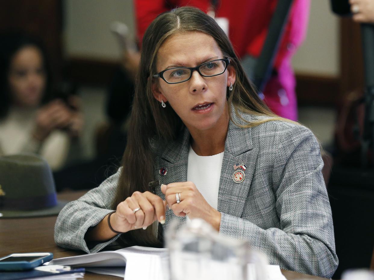 In this Thursday, Jan. 31, 2019, file photo, House Education Committee member Ashley Henley, R-Southaven, asks a question about teacher pay raise legislation presented before the committee, at the Capitol in Jackson, Miss. 