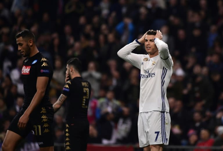 Real Madrid's forward Cristiano Ronaldo (R) gestures during the UEFA Champions League round of 16 first leg football match against SSC Napoli February 15, 2017