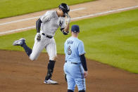 New York Yankees' Giancarlo Stanton, left, passes Toronto Blue Jays second baseman Travis Shaw as he runs the bases after hitting a home run during the fourth inning of a baseball game Thursday, Sept. 17, 2020, in New York. (AP Photo/Frank Franklin II)