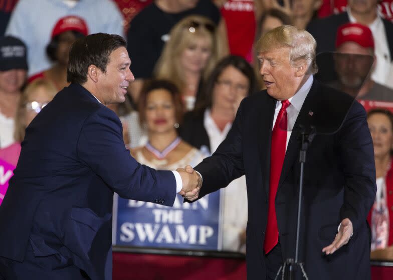 PENSACOLA, FL - NOVEMBER 03: U.S. President Donald Trump welcomes Florida gubernatorial candidate Ron DeSantis to the stage at a campaign rally at the Pensacola International Airport on November 3, 2018 in Pensacola, Florida. President Trump is campaigning in support of Republican candidates in the upcoming midterm elections. (Photo by Mark Wallheiser/Getty Images)