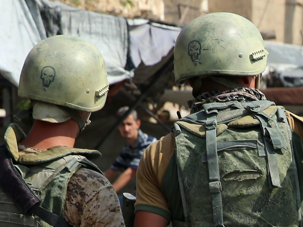 Russian soldiers on guard in Syria's eastern city of Deir Ezzor. The Kremlin says it does not track the presence of other Russian nationals in the country: AFP/Getty