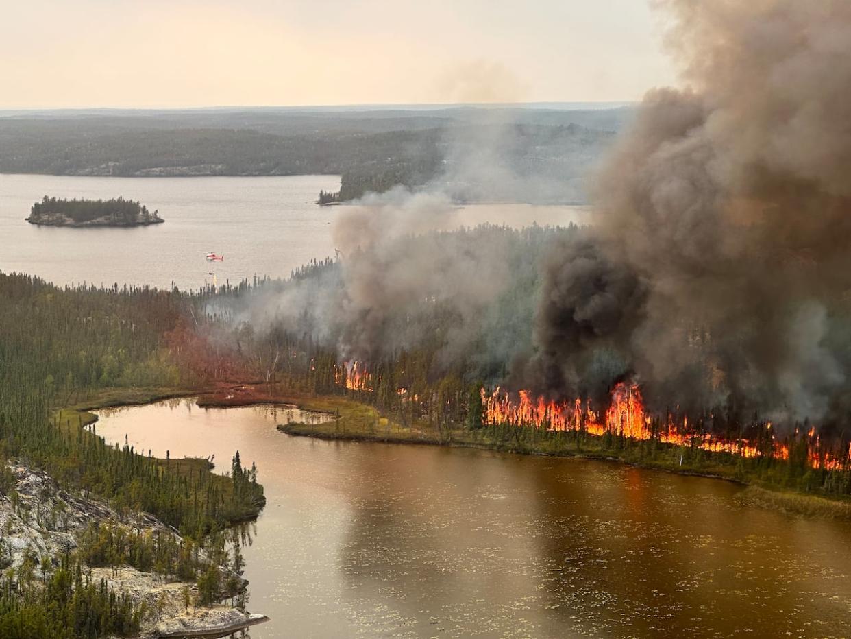 An aerial view of the wildfire threatening the Yellowknife area from Aug. 17. The intensity of the fire dampened over the weekend thanks to rain, lighter winds and cooler conditions. (N.W.T. Fire - image credit)