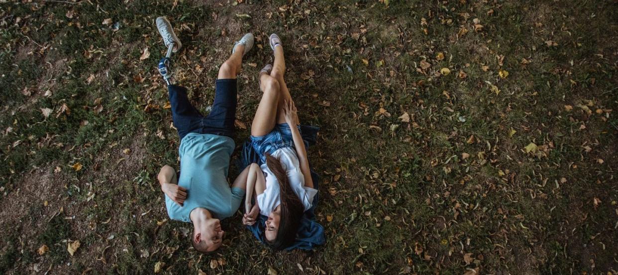 couple lying in park