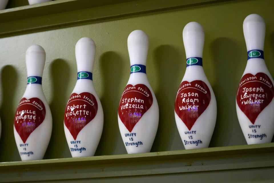 The names of some of the 18 victims of last October's mass shooting are memorialized on bowling pins at Just In Time Recreation, Wednesday, May 1, 2024, in Lewiston, Maine. (AP Photo/Robert F. Bukaty)