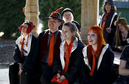 A group of participants listen to instructions during a workshop before the role play event at Czocha Castle in Sucha, west southern Poland April 9, 2015. REUTERS/Kacper Pempel