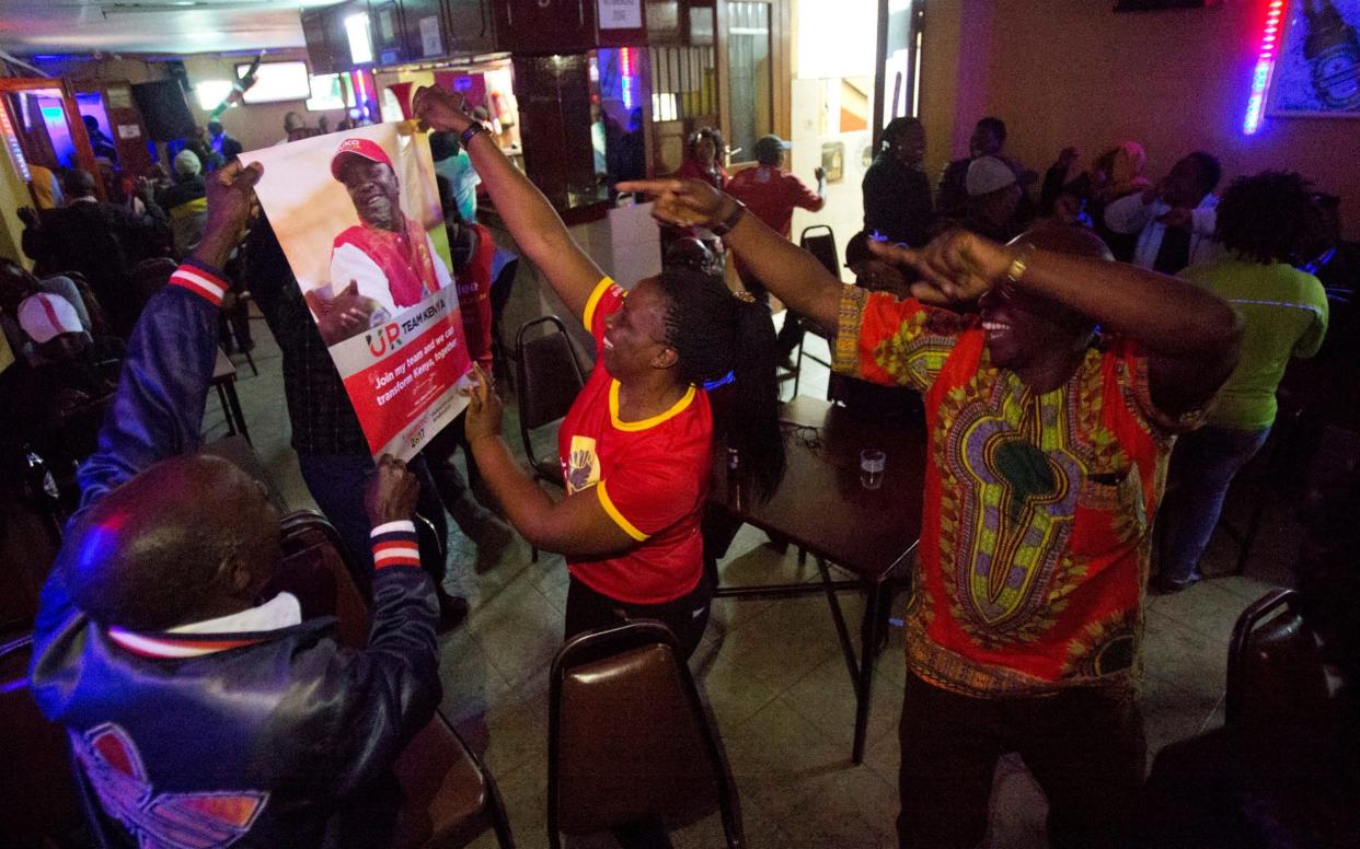 Supporters of President Uluru Kenyatta celebrate in Kikuyu Town, Kenya - AP