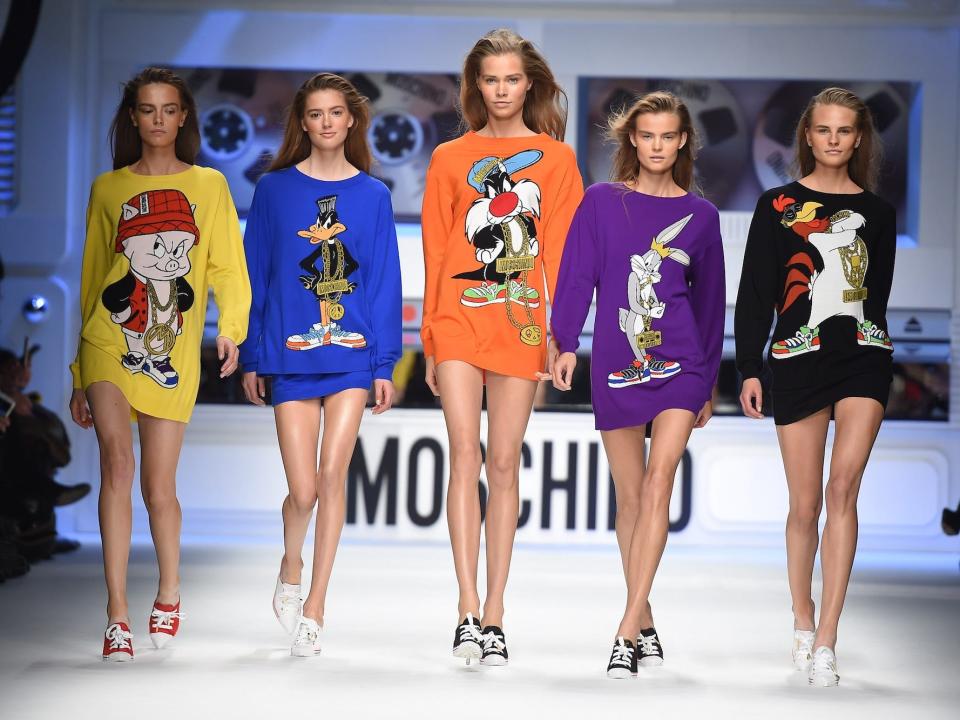 Models walk the runway during Moschino's Autumn/Winter 2015 show.