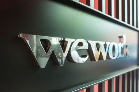 A logo of U.S. co-working firm WeWork is pictured during a signing ceremony in Shanghai, China April 12, 2018. Picture taken April 12, 2018. Jackal Pan via REUTERS