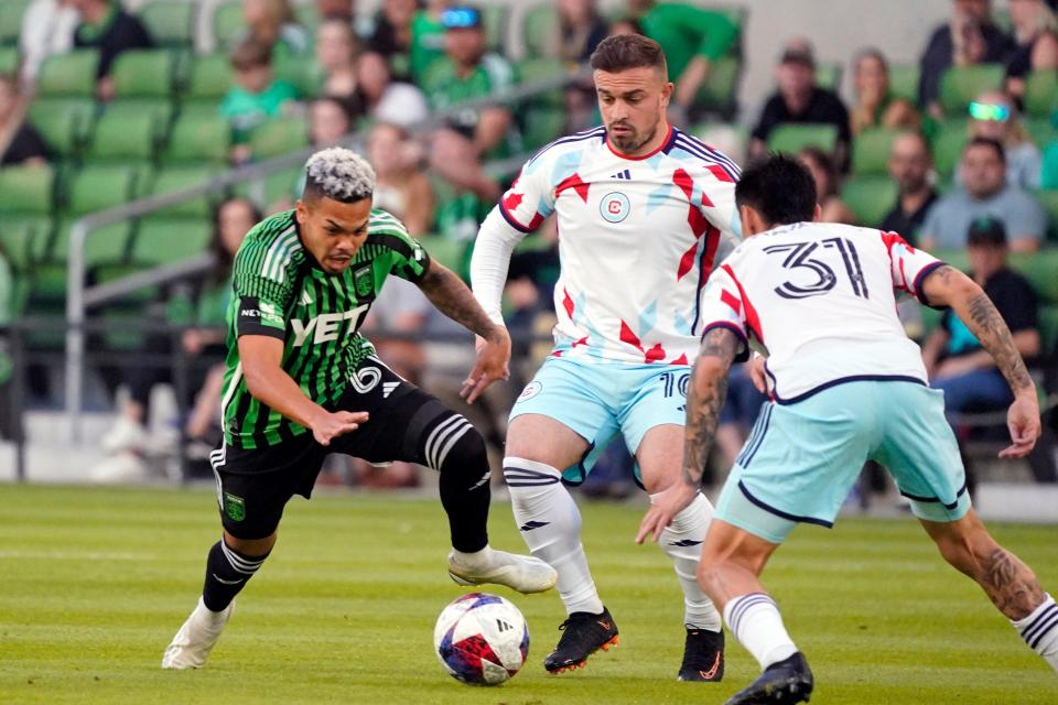 Austin FC's Dani Pereira, left, dribbles past Chicago's Xherdan Shaqiri, center, and Federico Navarro during El Tree's 2-1 loss Wednesday night.