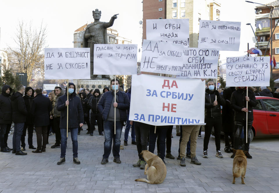 Kosovo Serbs protest against banning ethnic Serbs voting on Kosovo in Serbia's referendum on constitutional changes, in Mitrovica, Kosovo, Sunday, Jan. 16, 2022. The Serbian government has said the amendments are designed to boost independence of the judiciary and are part of reform needed for Serbia's European Union membership bid. (AP Photo/Bojan Slavkovic)