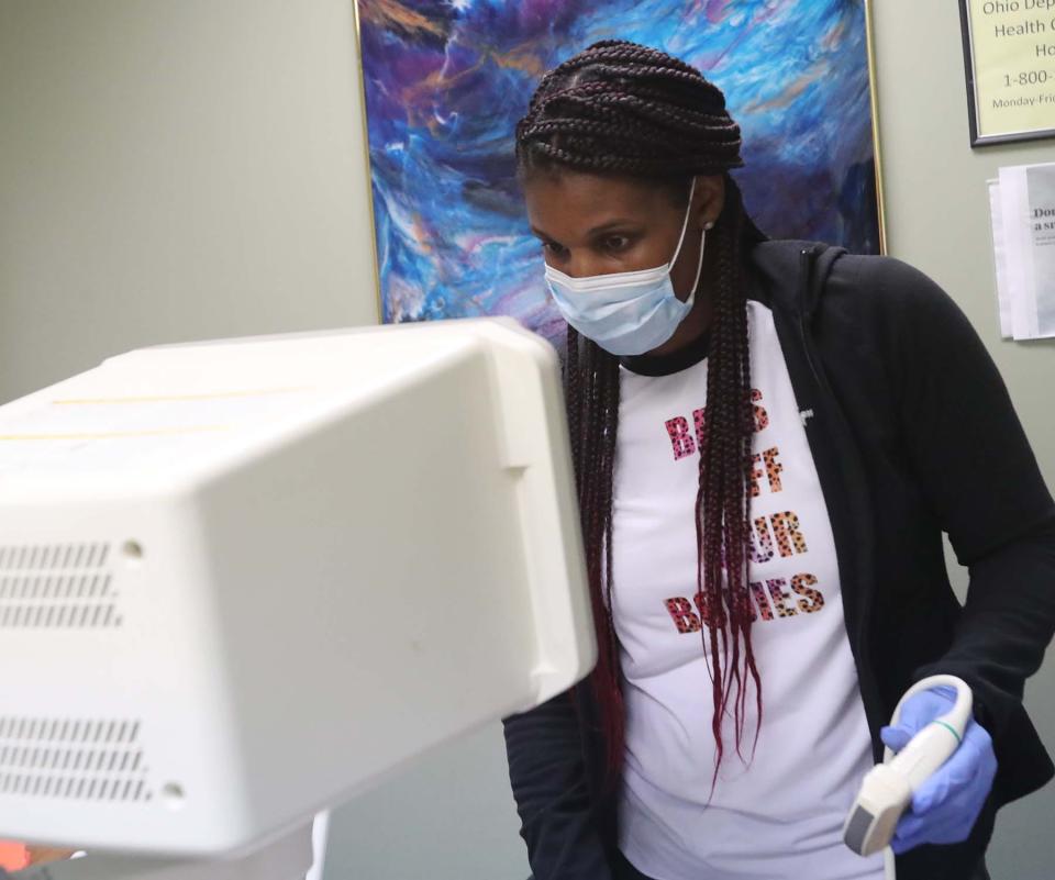 Denise, a registered nurse at the Northeast Ohio Women's Center in Cuyahoga Falls, looks Monday at the ultrasound results of a patient who is three days past Ohio's new six-week legal limit to have an abortion.