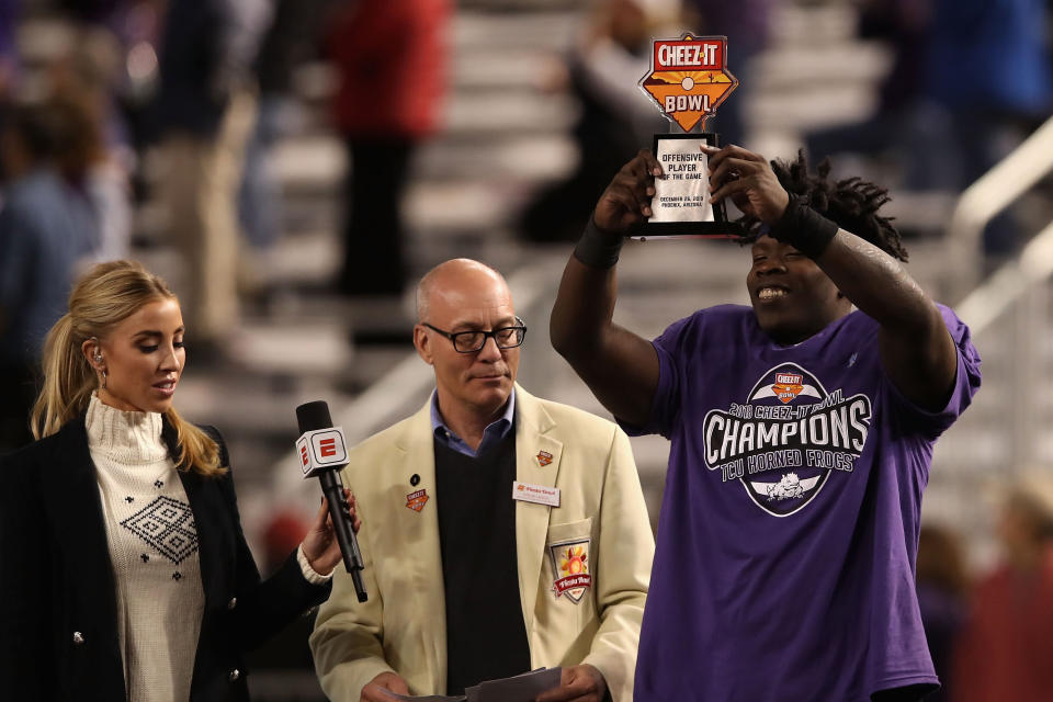 PHOENIX, ARIZONA - DECEMBER 26:  Offensive player of the game, running back Sewo Olonilua #33 of the TCU Horned Frogs celebrates following the Cheez-it Bowl at Chase Field on December 26, 2018 in Phoenix, Arizona. The Horned Frogs defeated the Golden Bears 10-7 in overtime. (Photo by Christian Petersen/Getty Images)