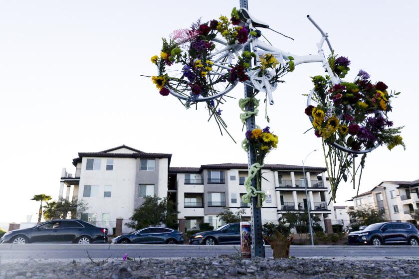 A memorial for Andreas Probst, a cyclist who was killed in a hit-and-run while riding his bike on Aug. 14, is adorned with flowers near the site of his death at the Northern Beltway Trail on Thursday, Sept. 7, 2023, in Las Vegas. Metropolitan police determined the teenager who struck Probst, a former California police officer, did so intentionally. (Ellen Schmidt/Las Vegas Review-Journal) @ellenschmidttt