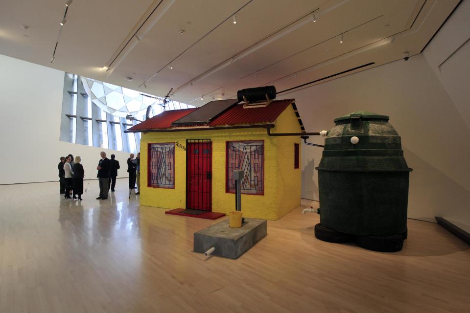 This Nov. 9, 2012 photo "Soweto House with Prepaid Water" by Marjetica Potrc of Slovenia is displayed inside the Eli and Edythe Broad Art Museum on the campus of Michigan State University in East Lansing, Mich. (AP Photo/Carlos Osorio)