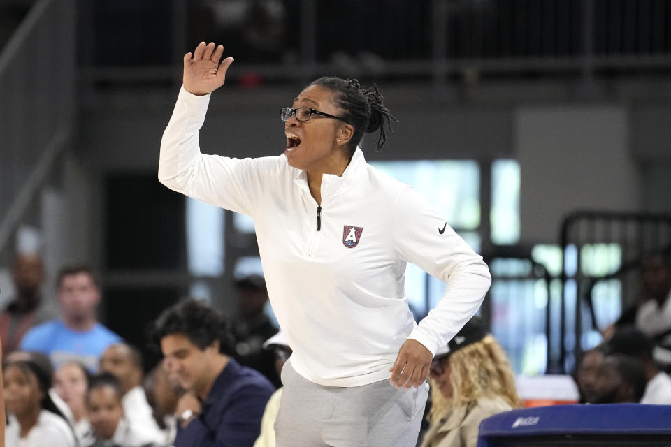 Altanta Dream head coach Tanisha Wright directs her team during the first half of a WNBA basketball game against the Chicago Sky Wednesday, July 10, 2024, in Chicago. (AP Photo/Charles Rex Arbogast)