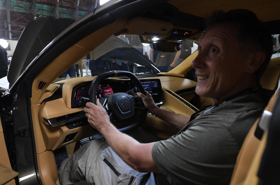 TUSTIN, CA - JULY 18: People take a closer look after the unveiling of the 2020 mid-engine C8 Corvette Stingray during a news conference on July 18, 2019 in Tustin, California. (Photo by Kevork Djansezian/Getty Images)