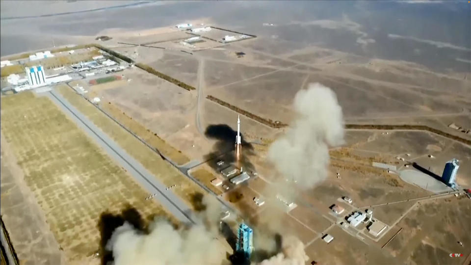 A drone looks down on the Shenzhou 17 spacecraft as its Long March 2F rocket climbs away from the Jiuquan Satellite Launch Center. / Credit: CCTV