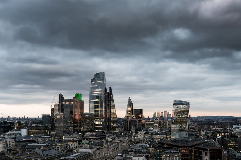 Storm clouds over the City of London’s financial district skyline.