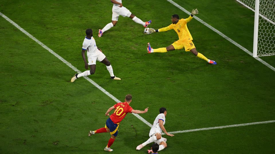 Dani Olmo fires his goal in off Jules Koundé. - Matthias Hangst/Getty Images