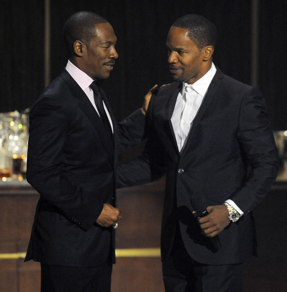 Eddie Murphy, left, is greeted onstage by actor/comedian Jamie Foxx at "Eddie Murphy: One Night Only," a celebration of Murphy's career at the Saban Theater on Saturday, Nov. 3, 2012, in Beverly Hills, Calif. Murphy and Foxx were cast members in the 2006 film "Dreamgirls." (Photo by Chris Pizzello/Invision)